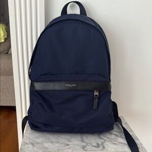 Michael Kors Blue Minimalist Backpack with Structured Design
